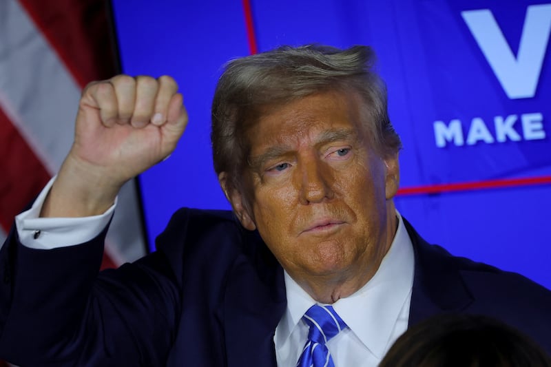 Republican presidential nominee and former U.S. President Donald Trump pumps a fist during a campaign stop in Milwaukee, Wisconsin, U.S., October 1, 2024. 