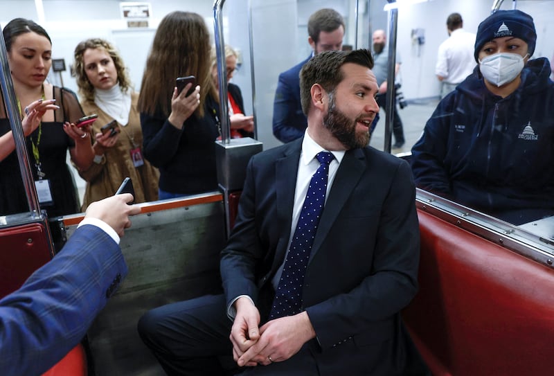 J.D. Vance speaks to the media in a Senate Subway car