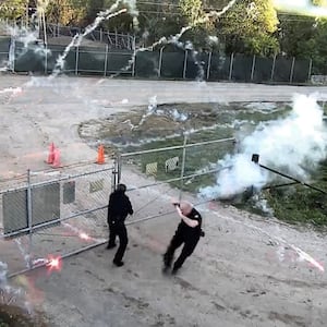 Fireworks erupt around police officers during protests in Atlanta