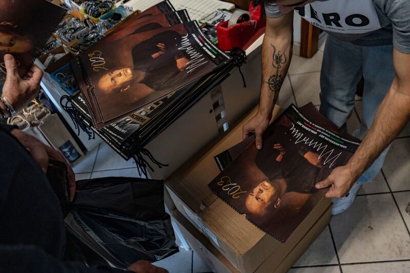 Calendars with Benito Mussolini's photo sold in a shop selling souvenirs from the fascist and Nazi period, as Italians mark one hundred years after Mussolini's March on Rome on October 30, 2022 in Predappio, Italy.