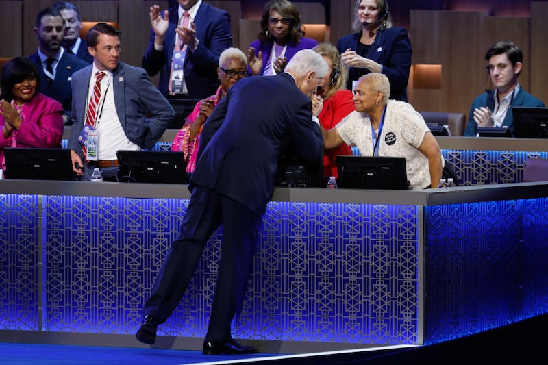 Former U.S. President Bill Clinton greets fans on stage during the third day of the Democratic National Convention in Chicago.