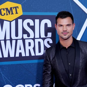 Taylor Lautner posing at the 2022 CMT Music Awards