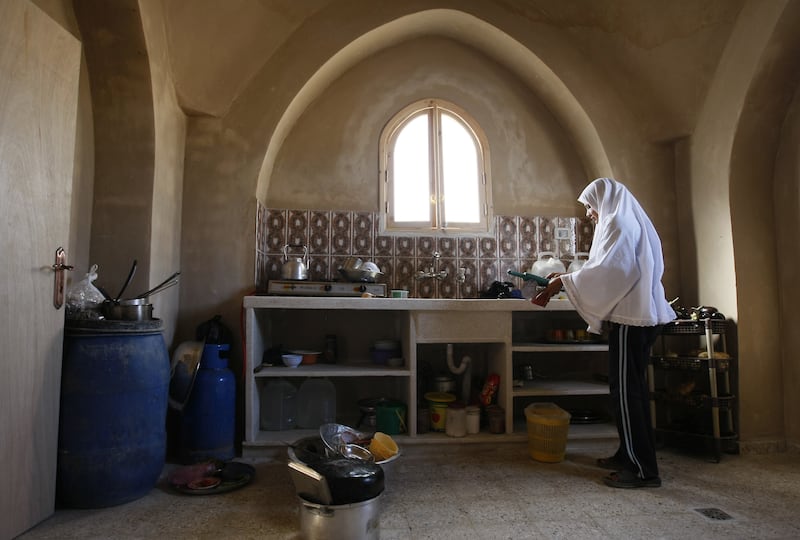 articles/2013/03/08/inside-the-gaza-kitchen-my-palestinian-shabbat-dinner/woman-in-gaza-kitchen-openz_urm6uc