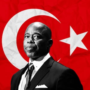 A photo illustration of NYC Mayor Eric Adams over the Turkish flag.