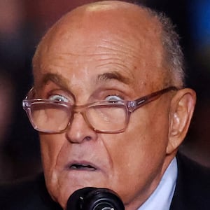 Rudy Giuliani speaks on stage at a Donald Trump event.