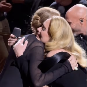 Adele and Céline Dion embrace during the former's performance at the The Colosseum at Caesars Palace in Las Vegas on October 26, 2024.