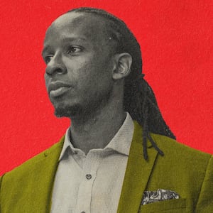  A photo illustration of Ibram Kendi wearing a yellow blazer on a red background