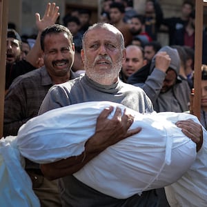 Palestinians mourn and carry the bodies of their loved ones who lost their lives after an attack of the Israeli army in Khan Younis, Gaza.