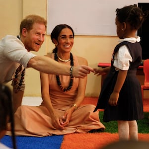 Prince Harry and Meghan Markle visit the Lightway Academy in Abuja, Nigeria.