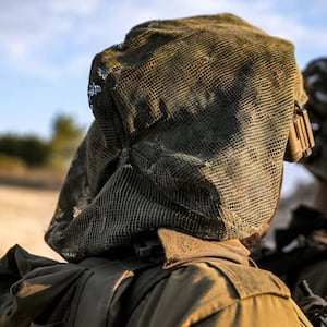 Israeli army soldiers stand at a position in the upper Galilee region of northern Israel near the border with Lebanon