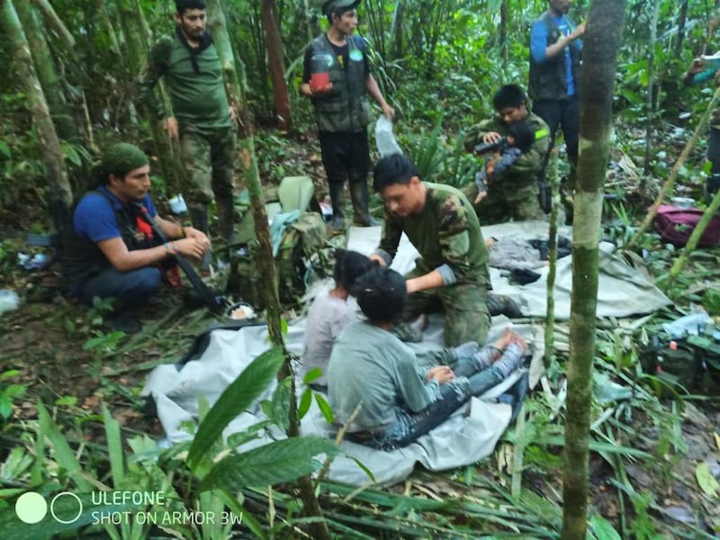 Rescuers shown with the missing children