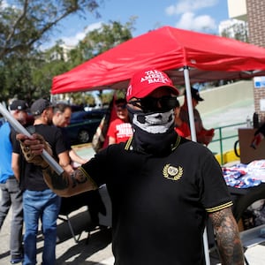 A Proud Boy and Donald Trump supporter engaged in "poll watching" in Florida.