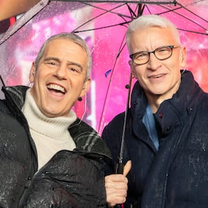 Andy Cohen and Anderson Cooper host CNN's New Year's Eve coverage in the rain in Times Square on December 31, 2024 in New York City.