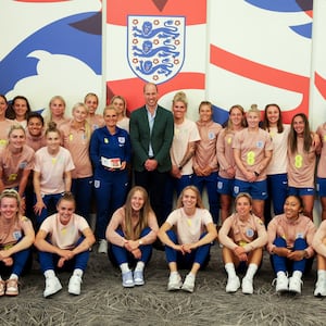 Britain's Prince William, President of The Football Association, poses with the England Women's team before the Women's World Cup.