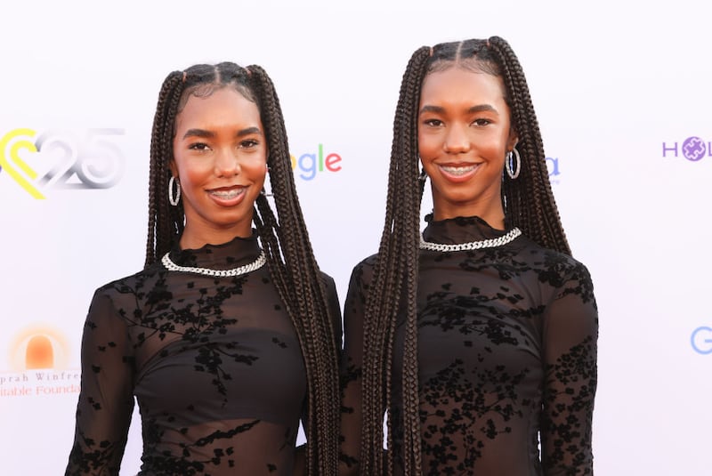 Jessie and D’Lila Combs smile together while wearing matching outfits and makeup