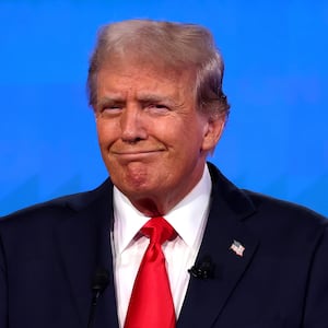 Republican presidential candidate, former U.S. President Donald Trump reacts during the CNN Presidential Debate at the CNN Studios