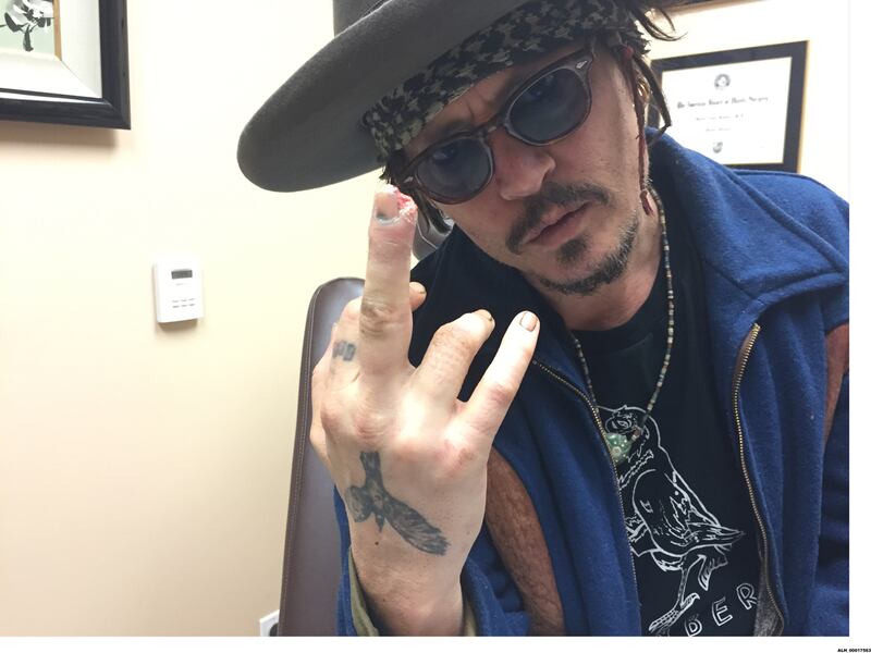 220523-depp-finger-embed-WARNING_kqo54c