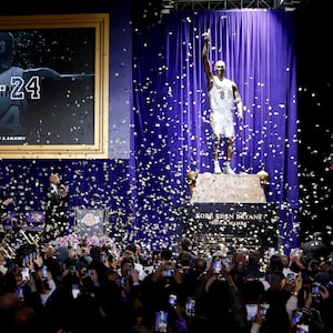 A statue for former Los Angeles Lakers guard Kobe Bryant is unveiled during a ceremony at Star Plaza outside of Crypto.com Arena.