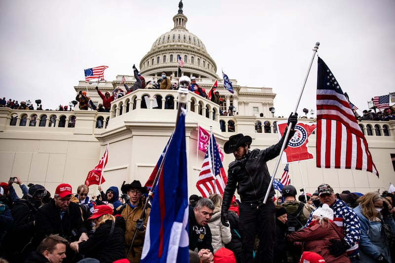 A photo including Pro-Trump Supporters at the U.S Capitol Building