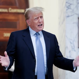 Former U.S. President Donald Trump delivers remarks after exiting the courtroom as he attends his Manhattan courthouse trial in a civil fraud case in New York