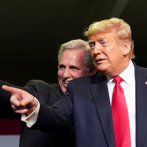 Kevin McCarthy (R-CA) and President Donald Trump react to the crowd as they hold an event on water accessibility for farms during a visit to Bakersfield, California, Feb. 19, 2020.