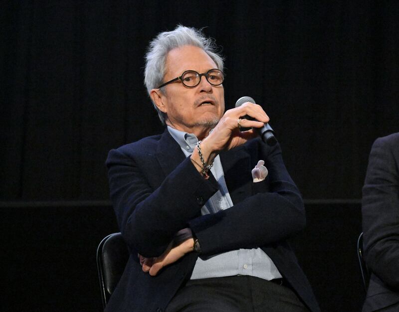 Michael Lindsay-Hogg speaks into a mic during a screening of ‘Let it Be’