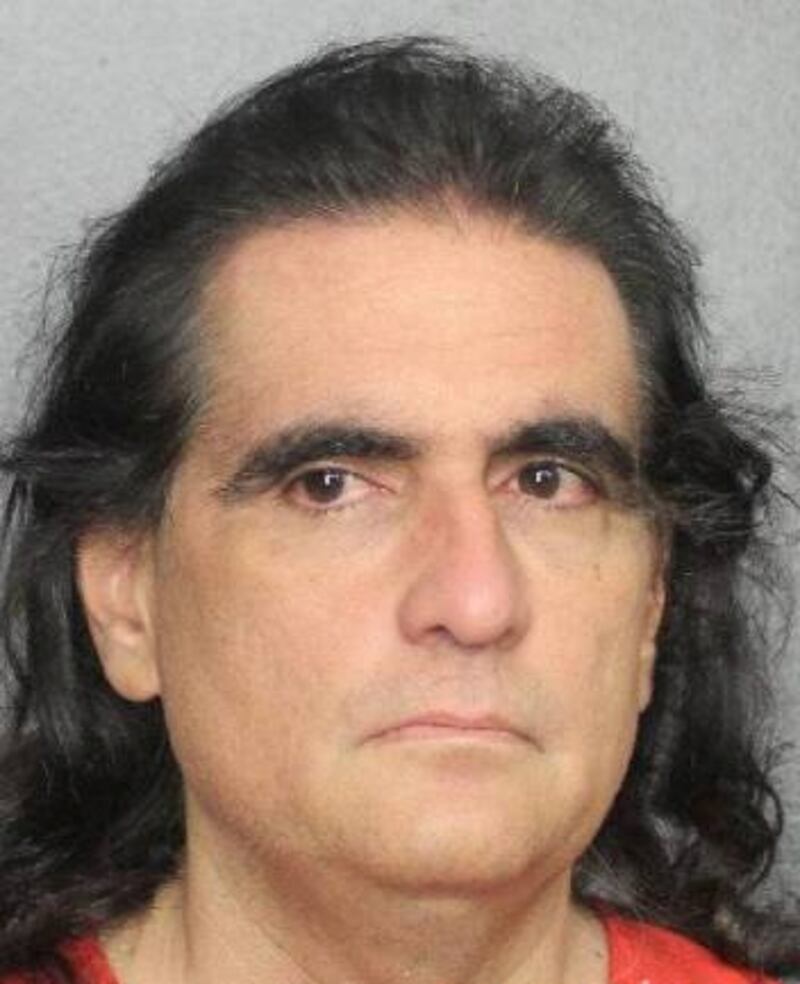 Mugshot of Alex Saab staring forward, wearing an orange jumpsuit.