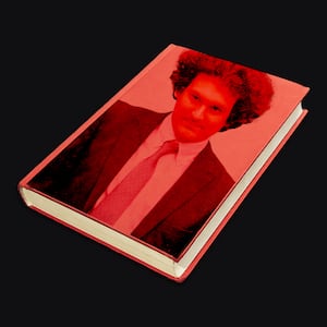 A photo illustration of Sam Bankman-Fried on the cover of a red book.