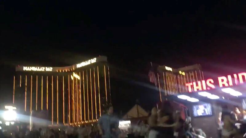 People run outside the Mandalay Bay Hotel after a gunman opened fire on attendees of the Route 91 Harvest Music Festival in Las Vegas, U.S., October 1, 2017 in this still image obtained from social media video.