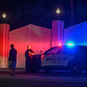 A police car is seen outside former US President Donald Trump's residence in Mar-A-Lago, Palm Beach, Florida