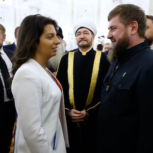 Chechnya's leader Ramzan Kadyrov (center R) talks to Margarita Simonyan,