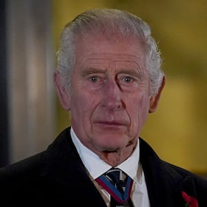 Britain's King Charles reacts after unveiling statues of Britain's Queen Elizabeth and Prince Phillip upon his and Queen Camilla arrival to attend the Royal British Legion Festival of Remembrance at the Royal Albert Hall in London, November 11, 2023.