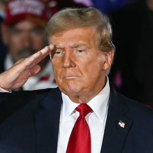 Former US President and Republican presidential candidate Donald Trump does a military salute during a campaign rally as he celebrates his 78th birthday at West Palm Convention Center, in West Palm Beach, Florida, on June 14, 2024.