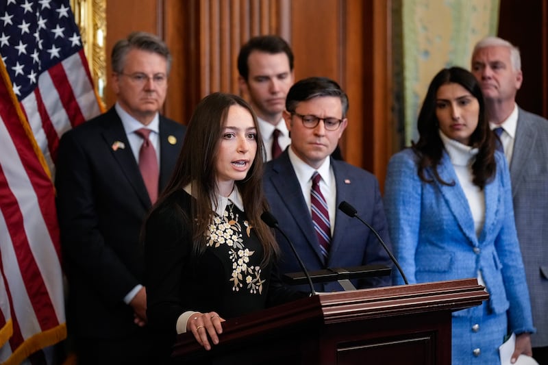 Bella Ingber, a college student from New York University, speaks during a news conference.