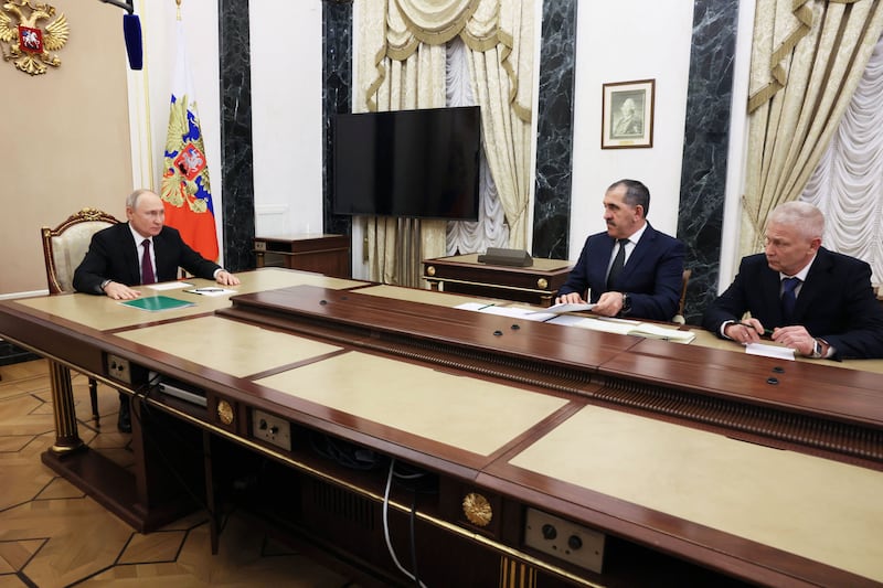 A photograph of Russia's President Vladimir Putin attends a meeting with Russian Deputy Defence Minister Yunus-Bek Yevkurov and, Andrei Troshev in Moscow on September 28, 2023. 