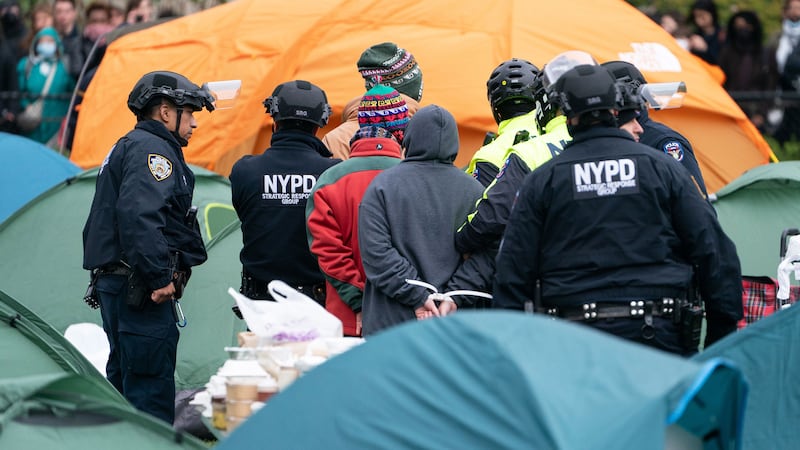 A photo including NYPD officers making arrests of pro-Palestinian protestors on lawn of Columbia University