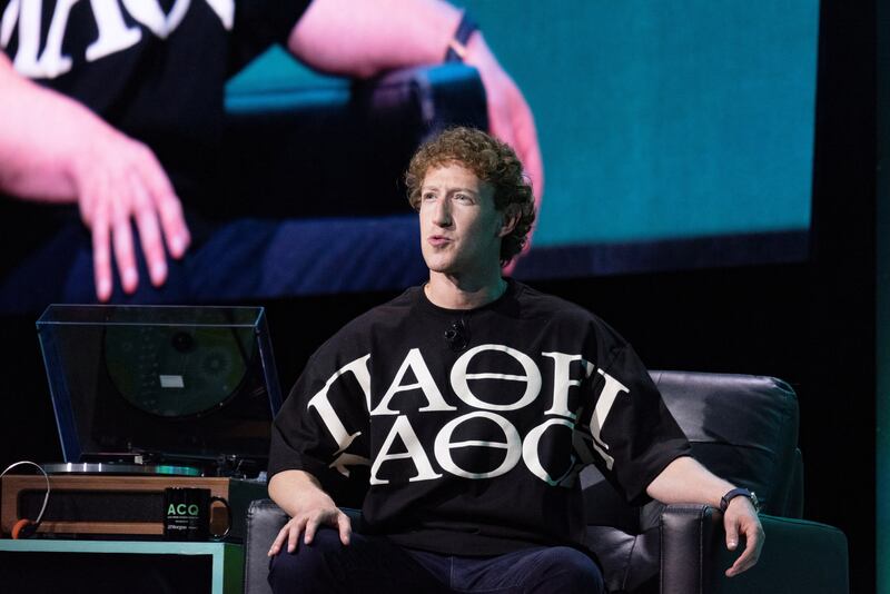 Zuckerberg wearing learning through suffering logo T-shirt