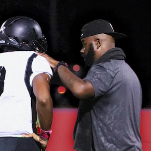 Roy Johnson with a Bishop Sycamore player