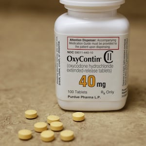 A bottle of prescription painkiller OxyContin, 40mg pills, made by Purdue Pharma L.D. sit on a counter at a local pharmacy, in Provo, Utah