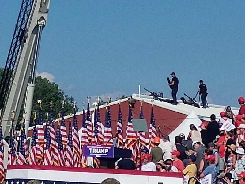 Snipers stand on top of a roof at Trump’s rally