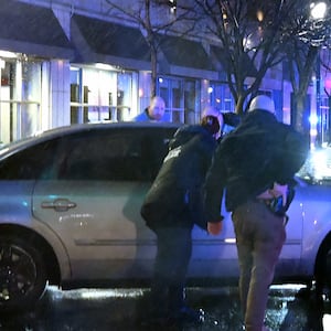 A photo illustration of Biden looking on as a car plows into his motorcade