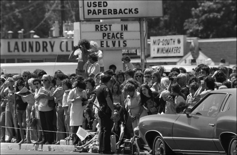 Elvis Presley fans line a street near his Graceland estate.