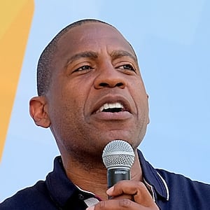 A photo of Ozy founder Carlos Watson onstage at Ozy Fest.