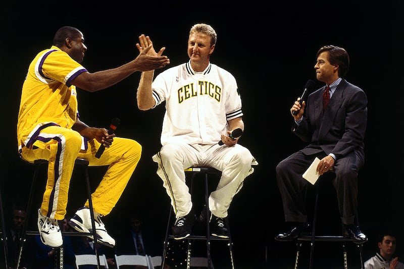 Larry Bird and Magic Johnson join announcer Bob Costas for an interview during Larry Bird Night at the Boston Garden in 1993.