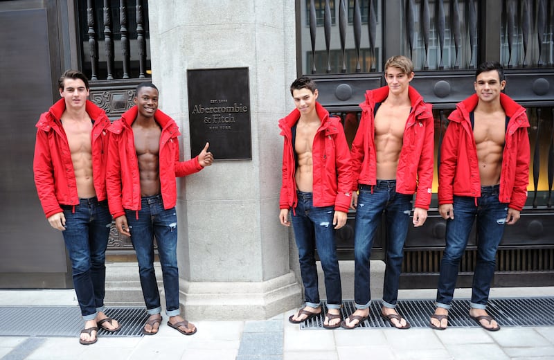 MUNICH, GERMANY - OCTOBER 25:  Male models pose outside the Abercrombie & Fitch flagship clothing store before the opening of Abercrombie & Fitch Munich flagship store on October 25, 2012 in Munich, Germany.  (Photo by Hannes Magerstaedt/Getty Images)