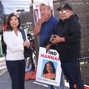 Los Angeles, California November 21, 2024-Volunteers put up flyers of missing Maui woman Hannah Kobayashi outside Crypto.com Arena in Downtown Los Angeles Thursday.   (Wally Skalij/Los Angeles Times via Getty Images)