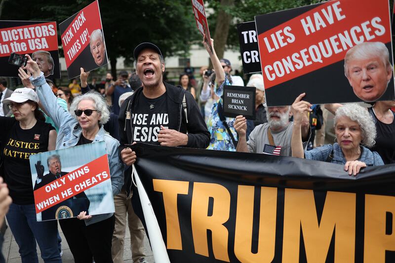  People react outside of the Manhattan Criminal Courthouse after former Donald Trump's conviction.