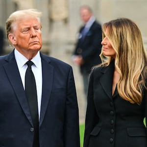 Former US President Donald Trump (L) stands with his wife Melania Trump (R) as they depart a funeral for Amalija Knavs, the former first lady's mother, outside the Church of Bethesda-by-the-Sea, in Palm Beach, Florida, on January 18, 2024.