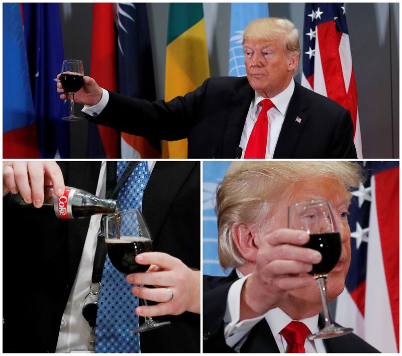 A White House staff member from the presidential food service pours a Diet Coke for U.S. President Donald Trump—who then uses it to conduct a toast.