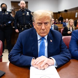 Former president Donald Trump sits in the courtroom during his hush-money trial.